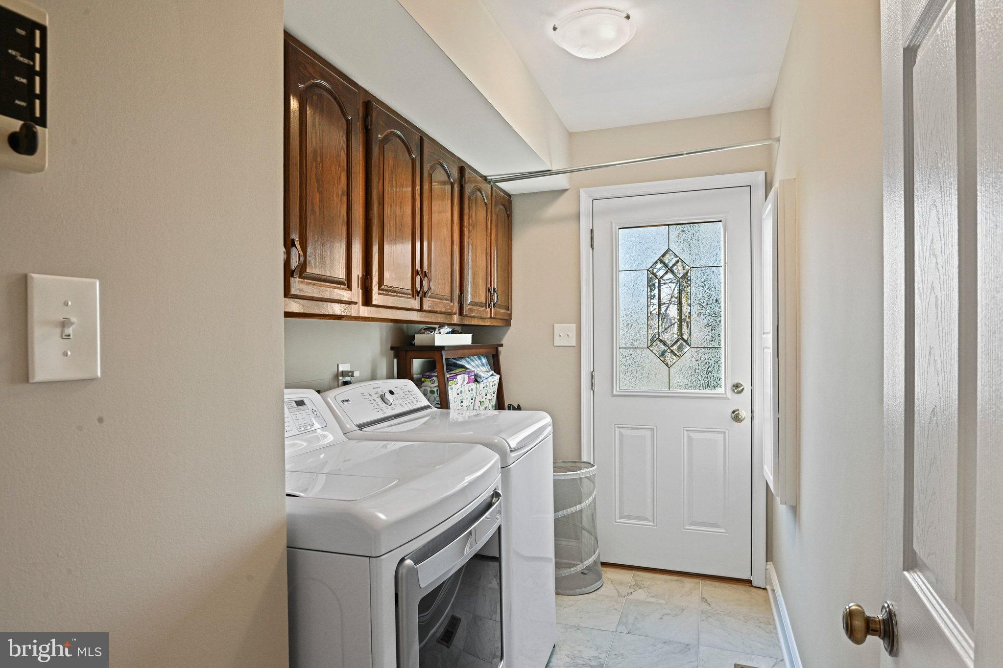 2707 Glencroft Road Vienna, VA 22181 - Photo 14 of 53 a utility room with dryer and washer
