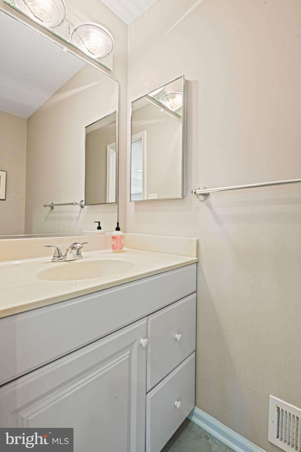 2707 Glencroft Road Vienna, VA 22181 - Photo 16 of 53 a bathroom with a sink and a mirror