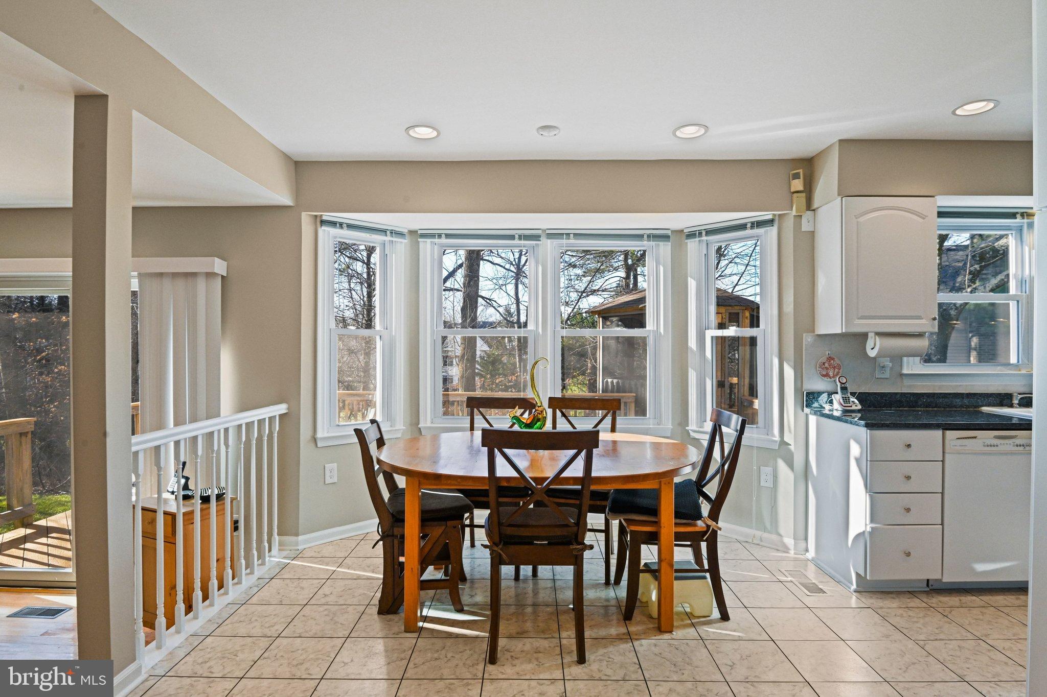 2707 Glencroft Road Vienna, VA 22181 - Photo 24 of 53 a view of a dining room with furniture and front door