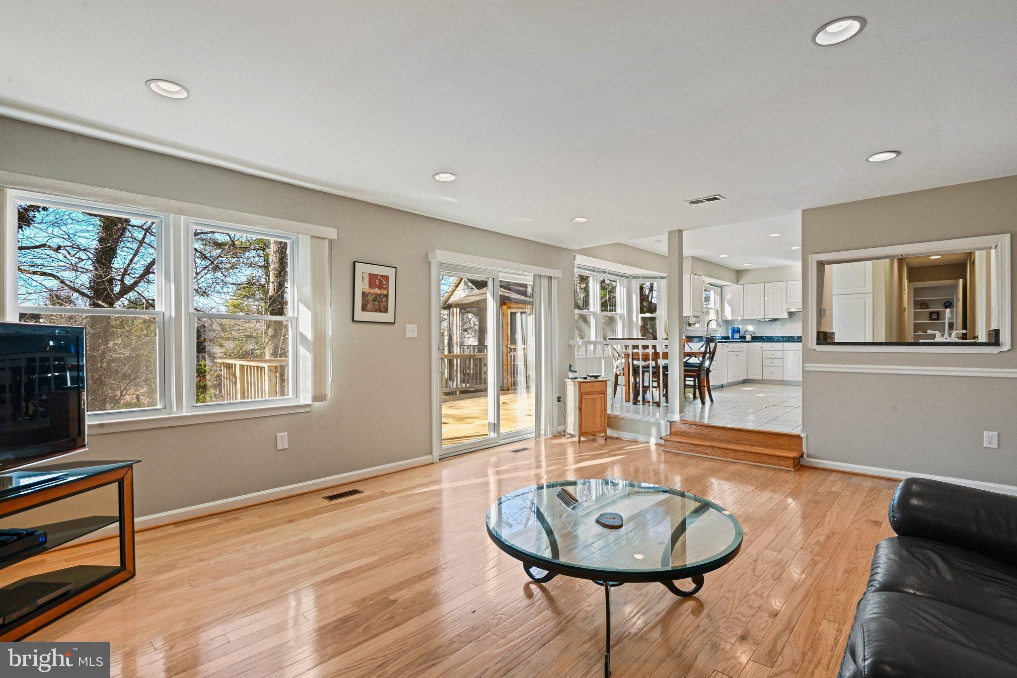 2707 Glencroft Road Vienna, VA 22181 - Photo 26 of 53 a living room with furniture and a wooden floor