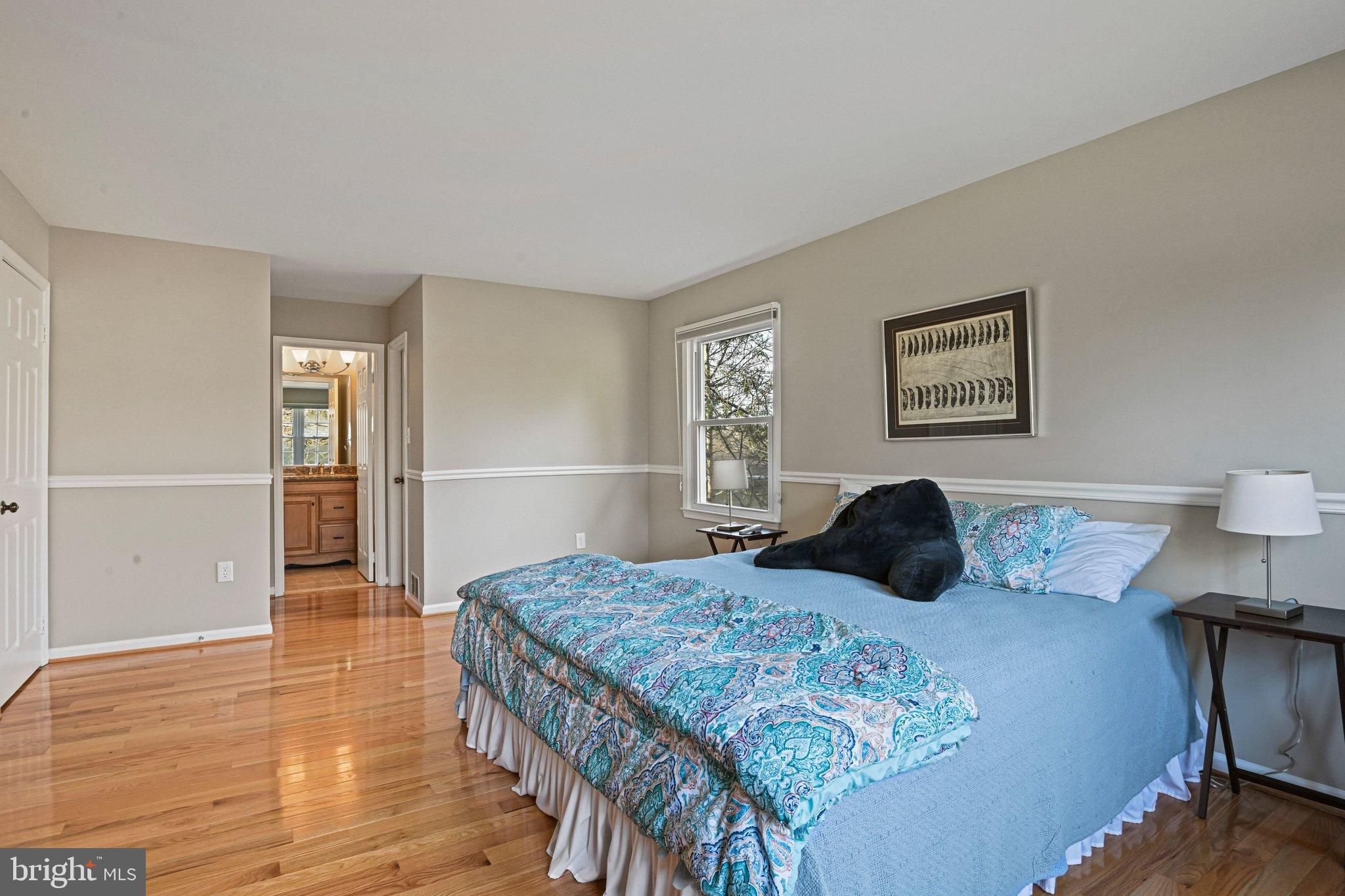 2707 Glencroft Road Vienna, VA 22181 - Photo 30 of 53 a bedroom with a bed and a table in it