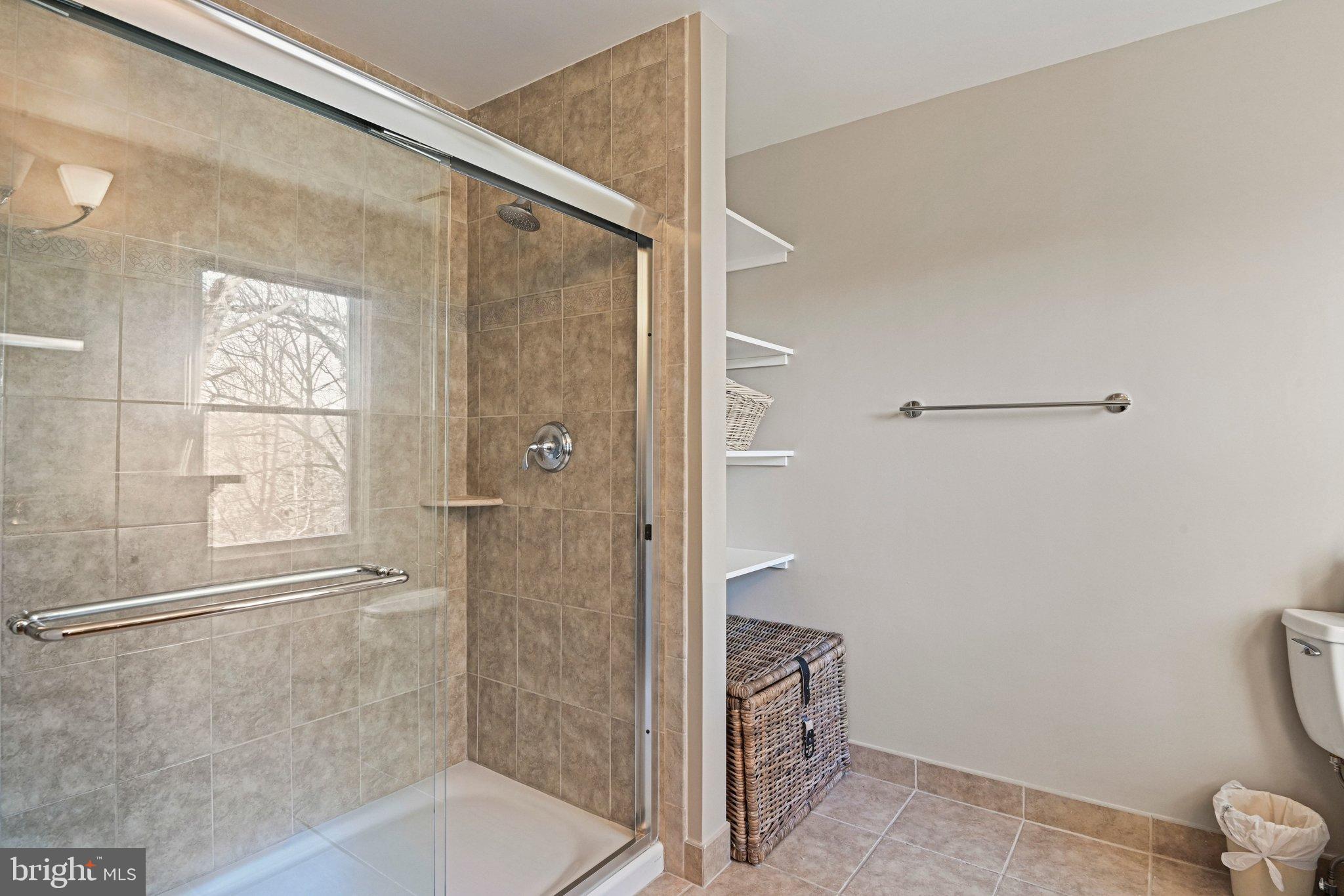 2707 Glencroft Road Vienna, VA 22181 - Photo 32 of 53 a bathroom with a shower and a toilet