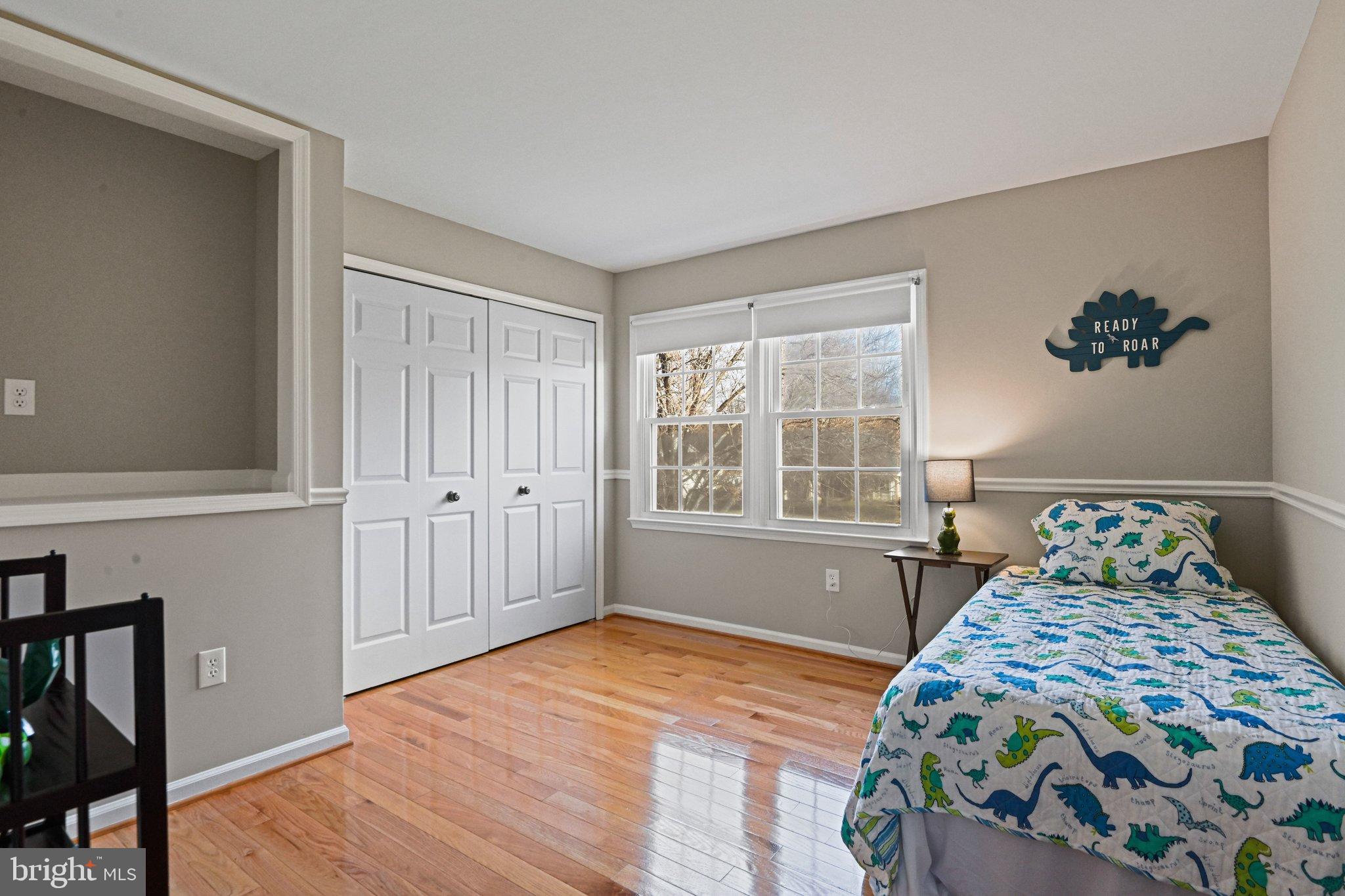 2707 Glencroft Road Vienna, VA 22181 - Photo 38 of 53 a bedroom with a bed and wooden floor
