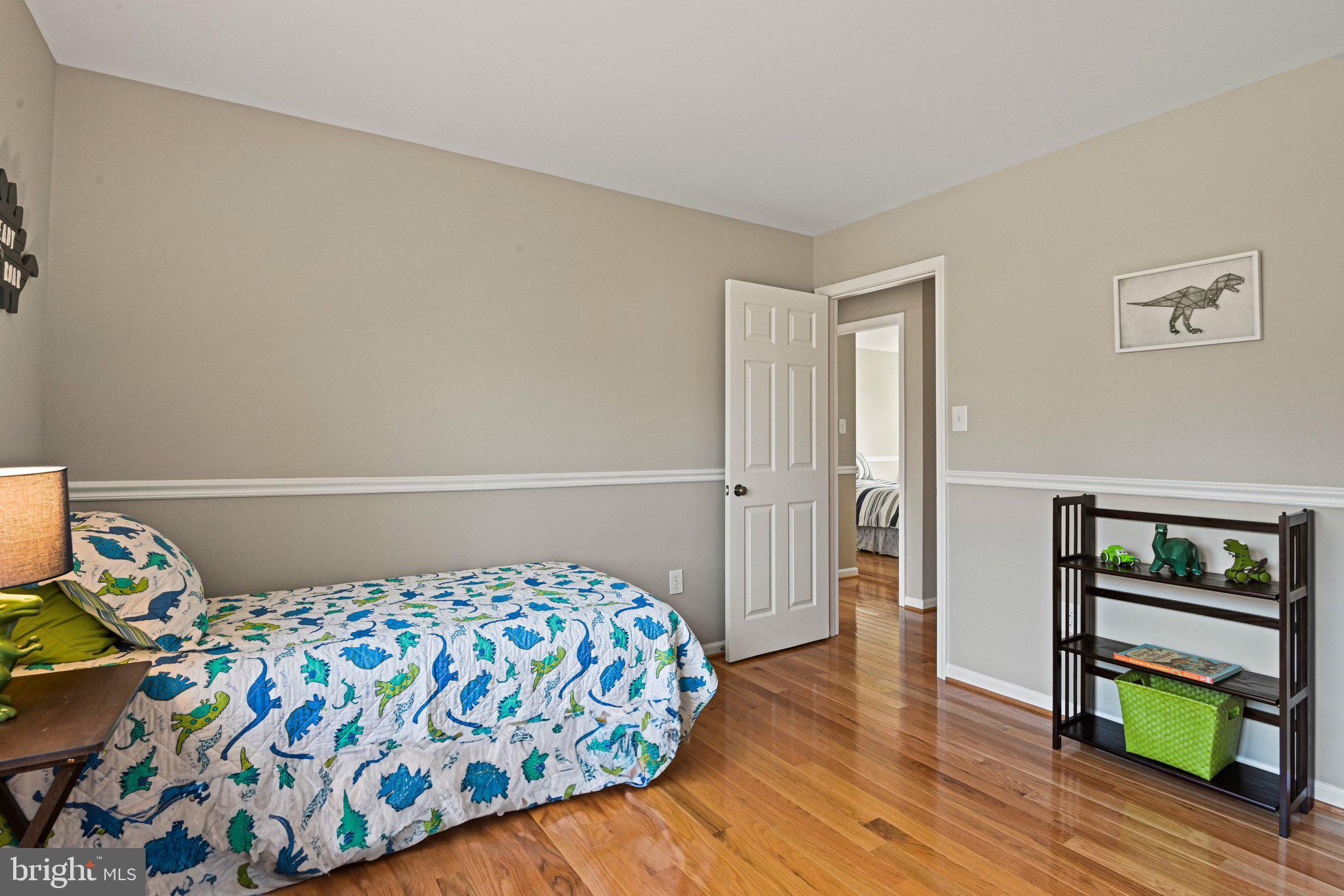 2707 Glencroft Road Vienna, VA 22181 - Photo 39 of 53 a bedroom with a bed and a dresser