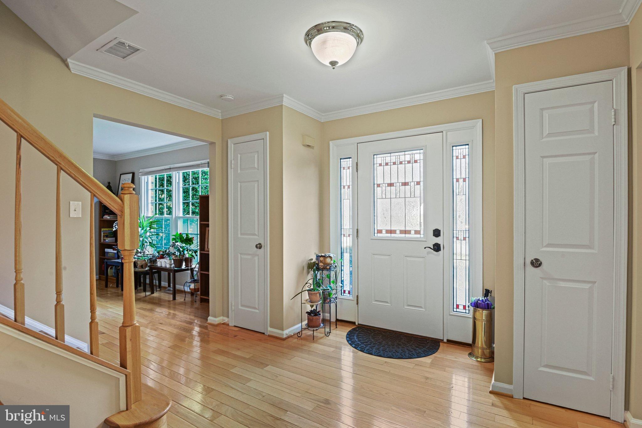 2707 Glencroft Road Vienna, VA 22181 - Photo 4 of 53 a view of a livingroom with wooden floor and furniture