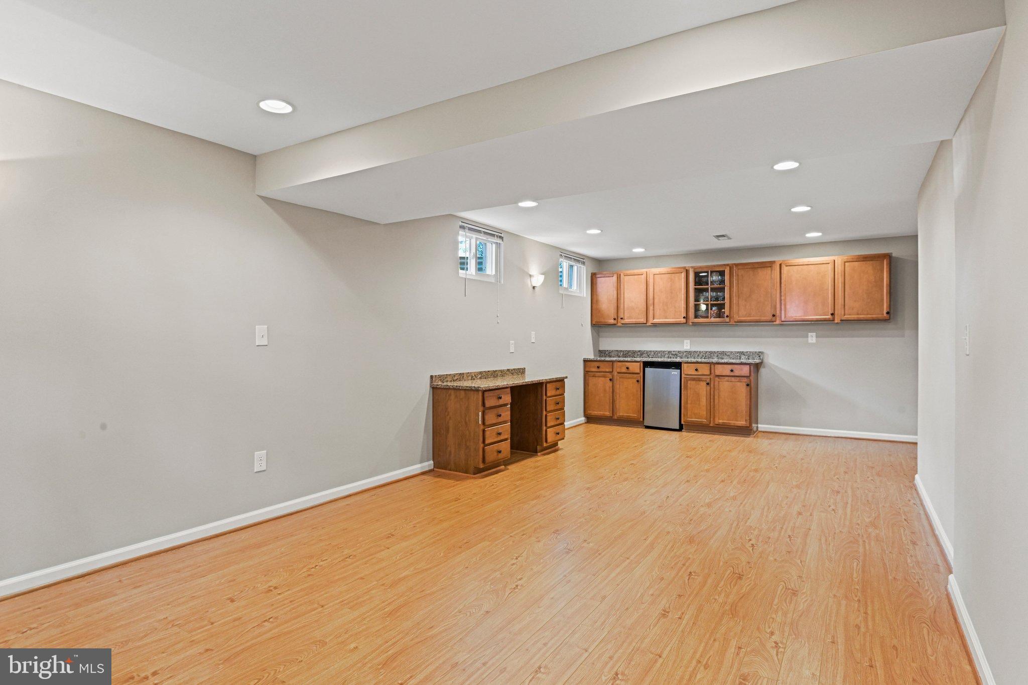 2707 Glencroft Road Vienna, VA 22181 - Photo 46 of 53 a view of a big room with wooden floor and windows