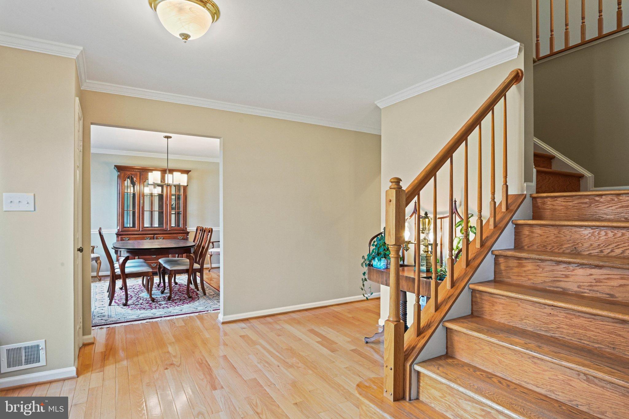 2707 Glencroft Road Vienna, VA 22181 - Photo 5 of 53 a view of a livingroom with wooden floor and furniture