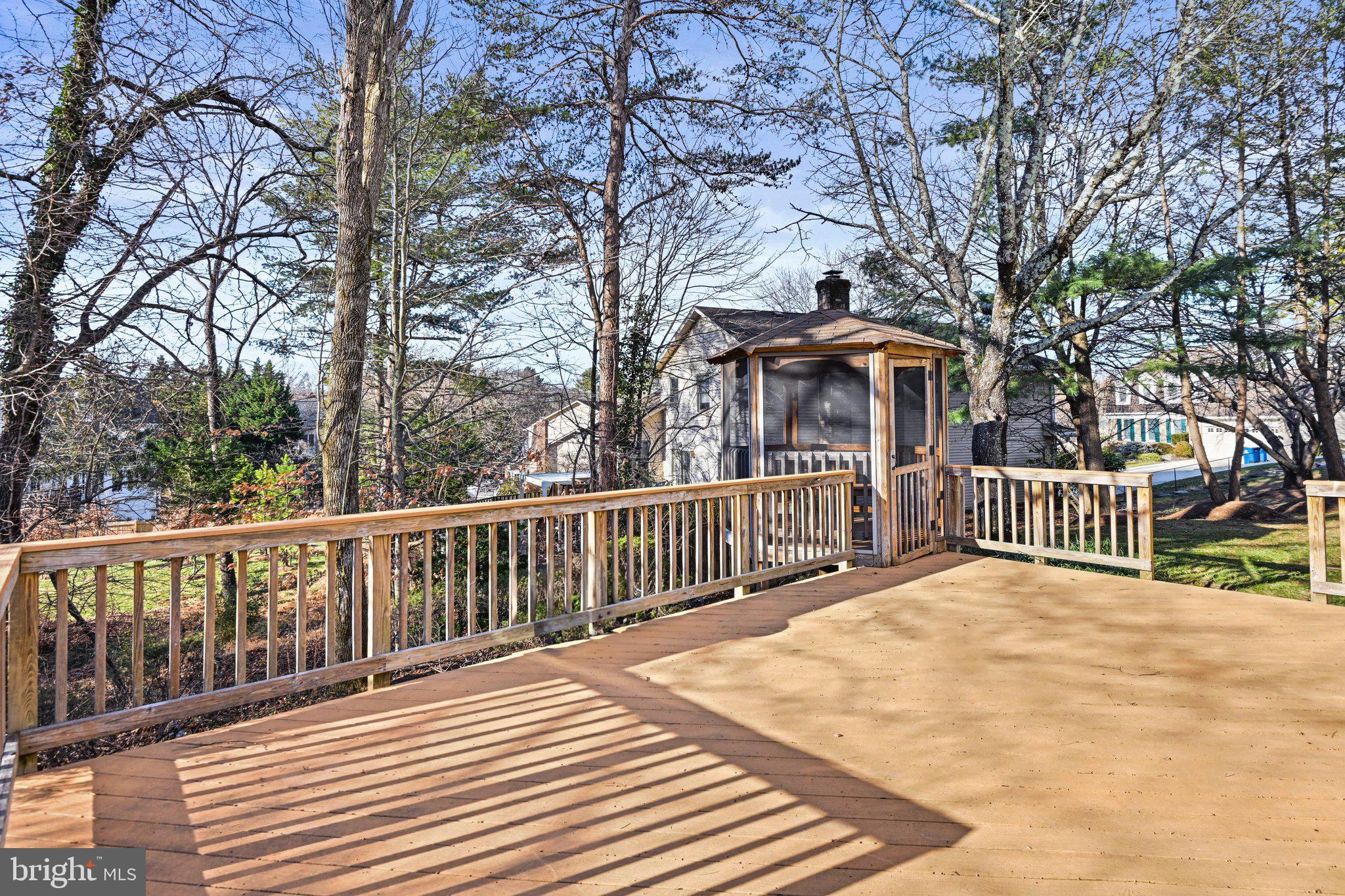 2707 Glencroft Road Vienna, VA 22181 - Photo 52 of 53 a view of a wooden deck with large trees