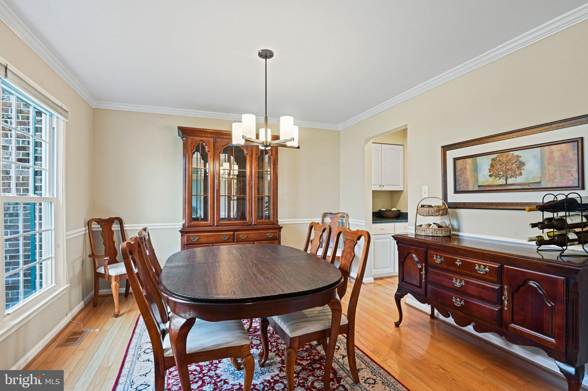 2707 Glencroft Road Vienna, VA 22181 - Photo 6 of 53 a view of a a dining room with furniture window and wooden floor