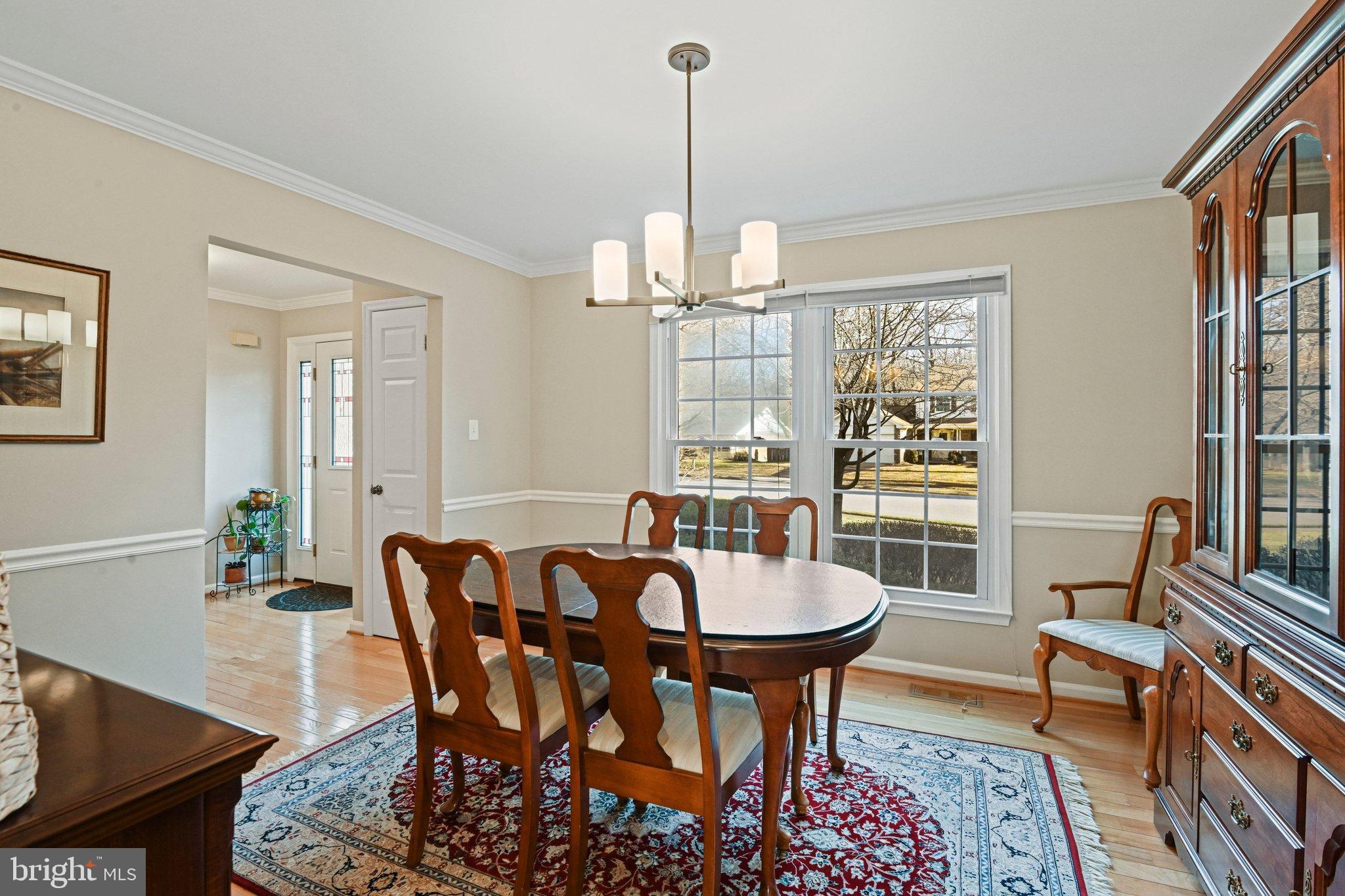 2707 Glencroft Road Vienna, VA 22181 - Photo 7 of 53 a view of a dining room with furniture window and wooden floor