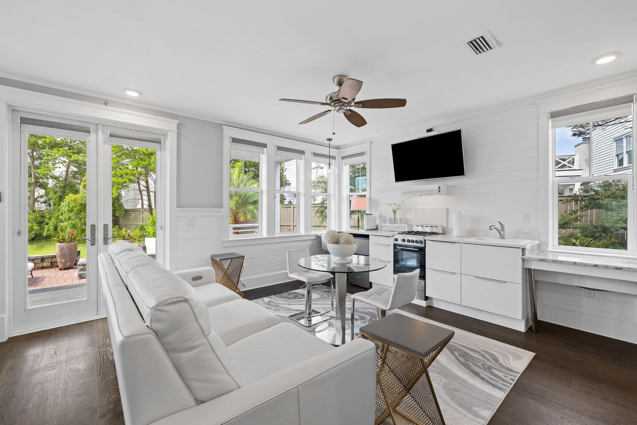 4 Clipper Street Inlet Beach, FL 32461 - Photo 12 of 49 a living room with furniture a flat screen tv and a large window