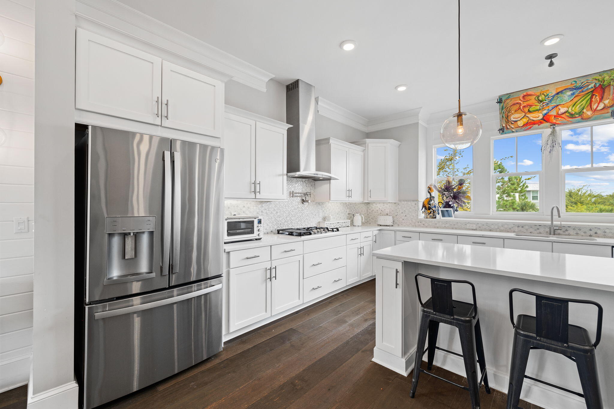 4 Clipper Street Inlet Beach, FL 32461 - Photo 19 of 49 a kitchen with granite countertop stainless steel appliances a sink and a refrigerator