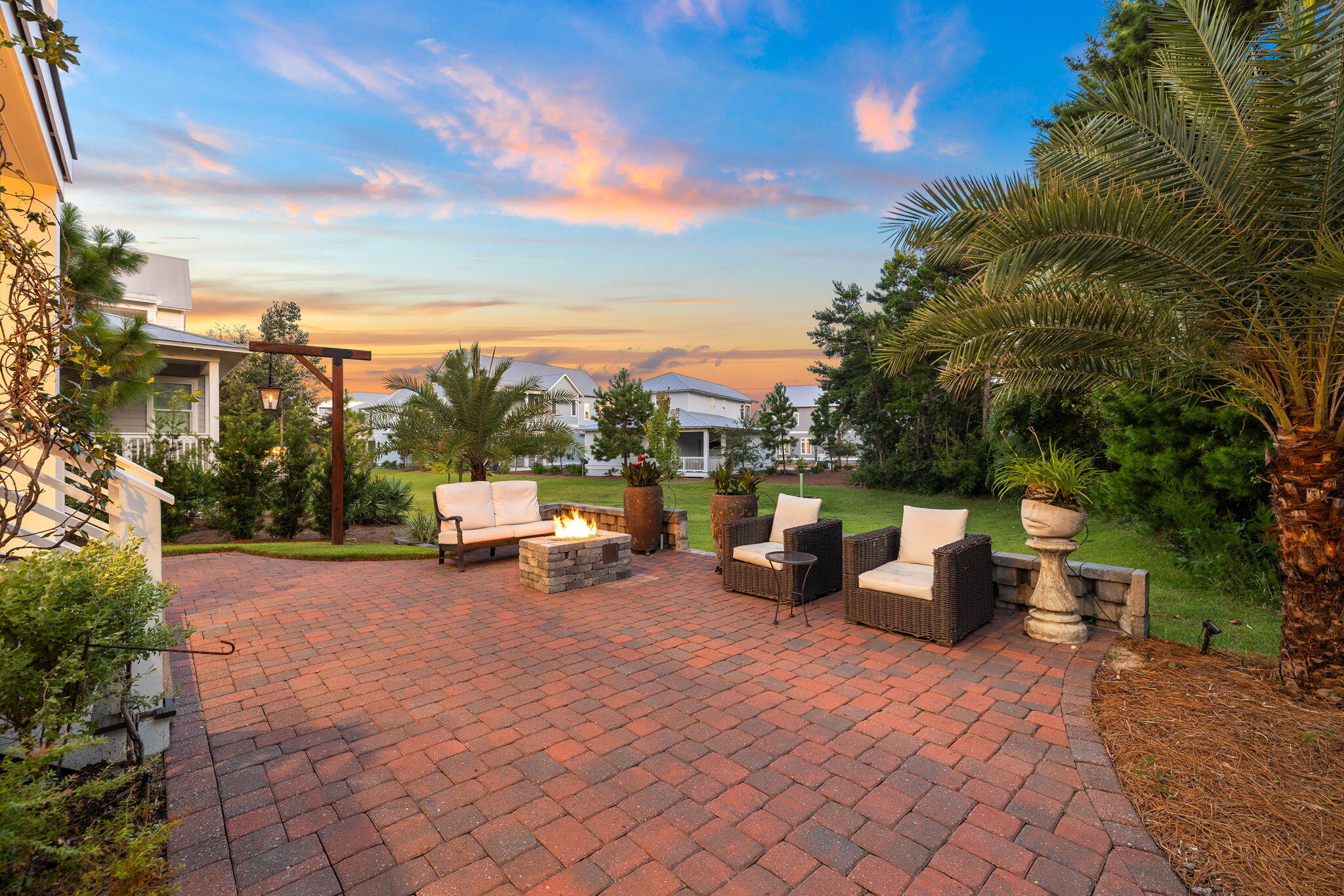4 Clipper Street Inlet Beach, FL 32461 - Photo 33 of 49 a view of a patio with dining table and chairs with a patio