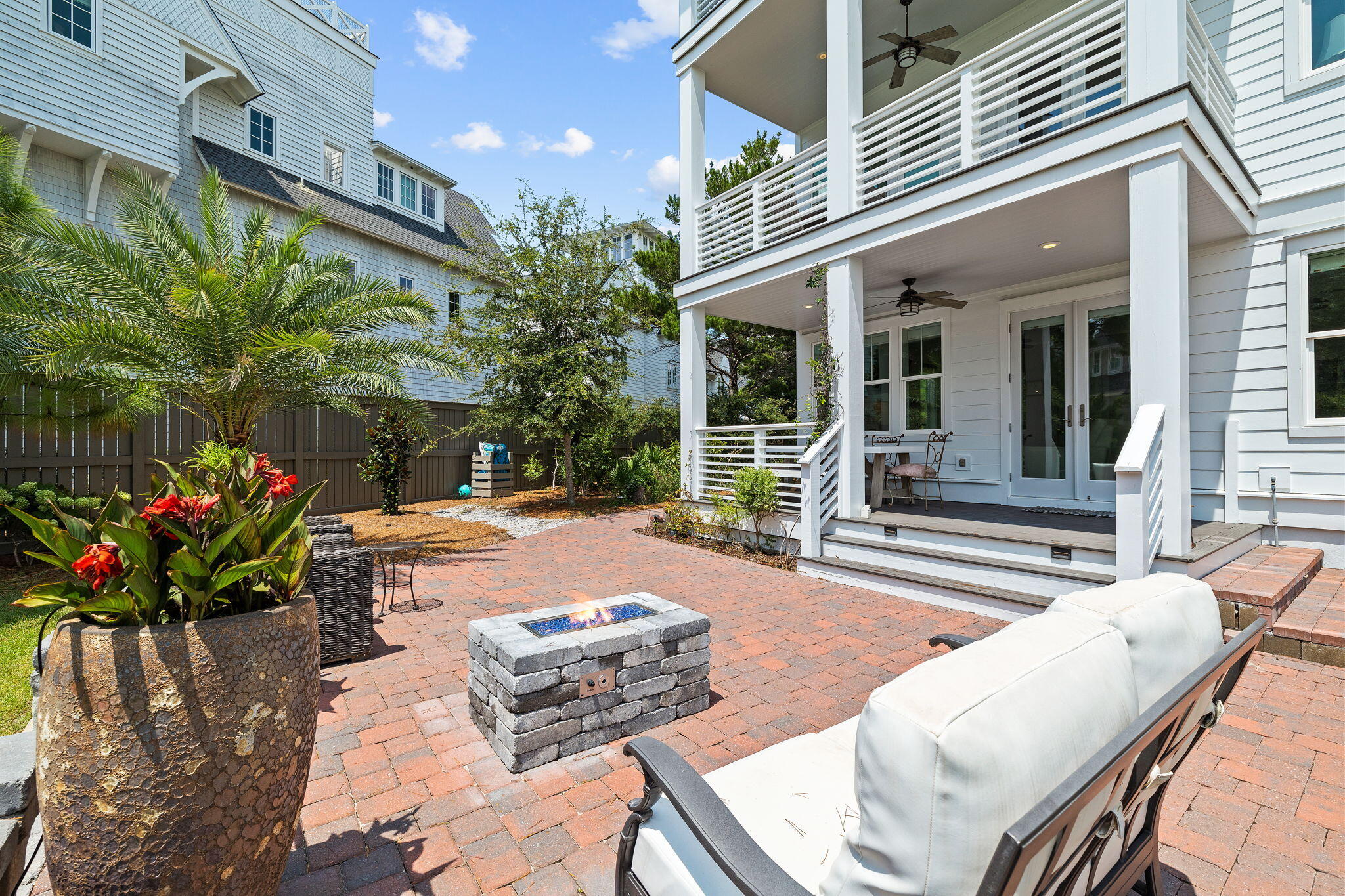 4 Clipper Street Inlet Beach, FL 32461 - Photo 34 of 49 a view of a patio with couches table and chairs and potted plants