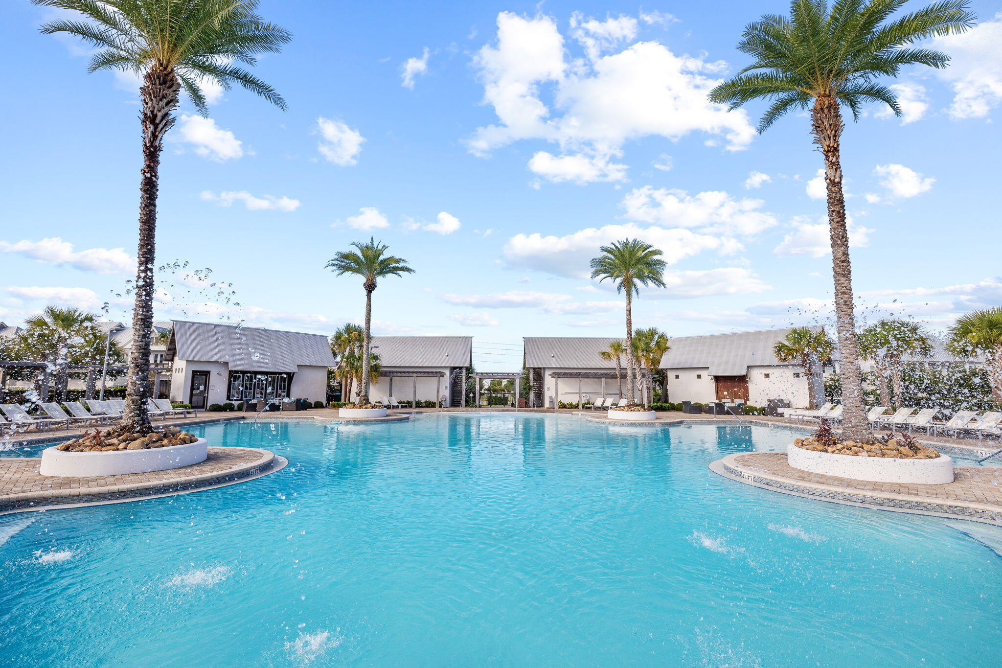 4 Clipper Street Inlet Beach, FL 32461 - Photo 42 of 49 a view of a patio with dining table and chairs with potted plants