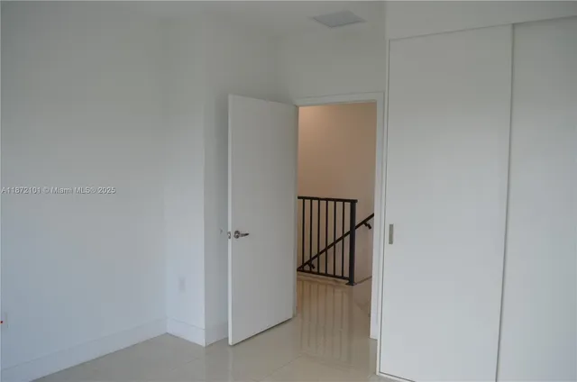a view of hallway with wooden floor