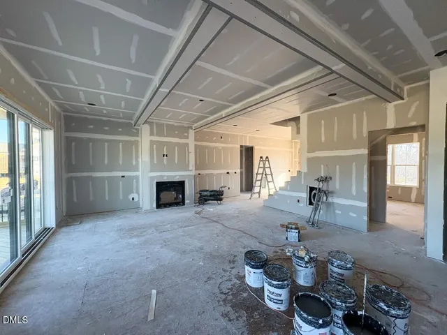 a view of a livingroom with furniture and a fireplace
