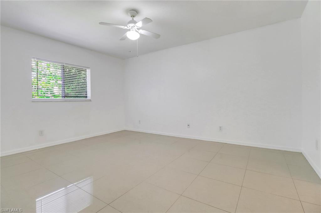 765 Aprile Avenue South Lehigh Acres, FL 33974 - Photo 14 of 32 an empty room with a window and a fan