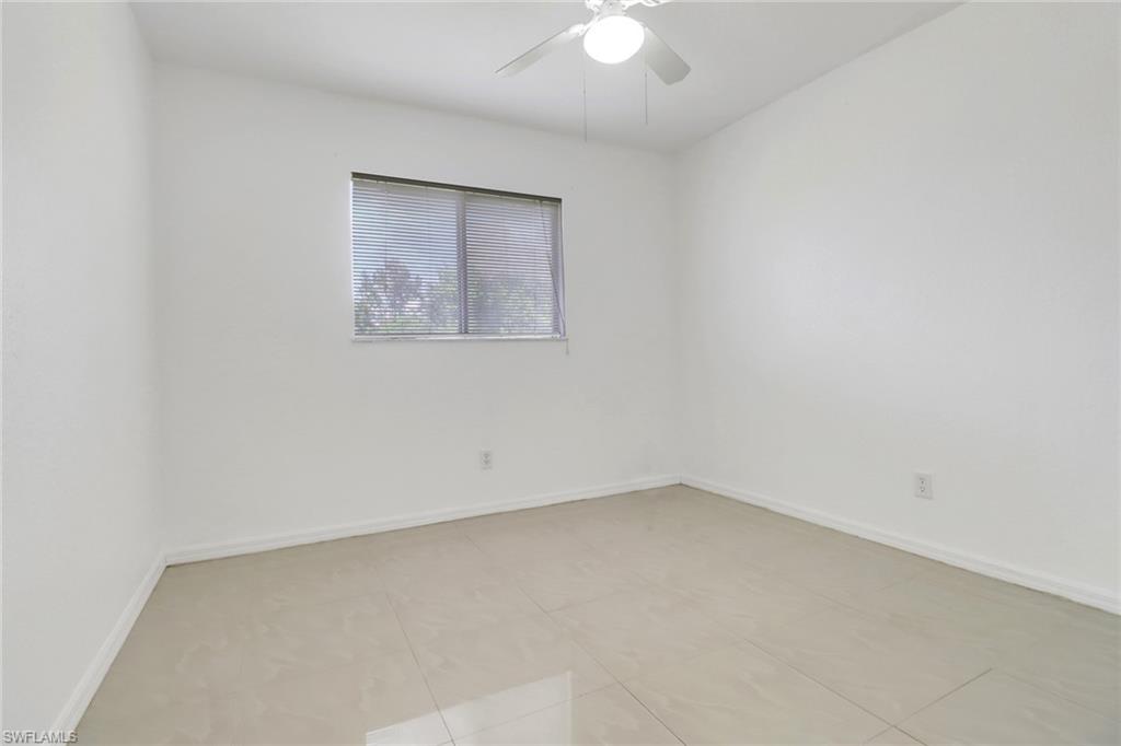 765 Aprile Avenue South Lehigh Acres, FL 33974 - Photo 19 of 32 an empty room with a workbench