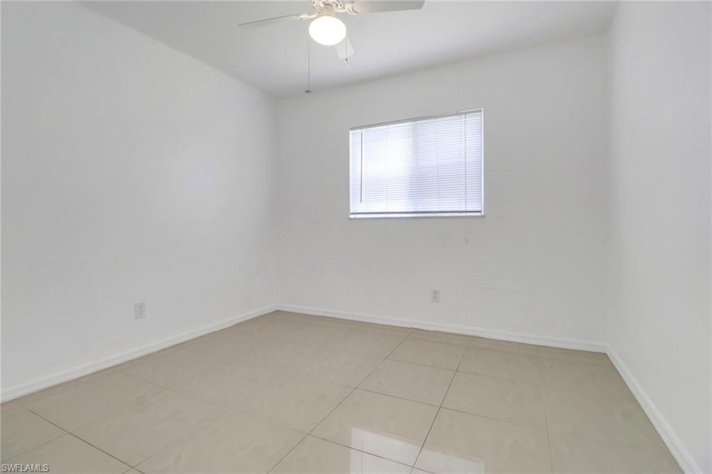 765 Aprile Avenue South Lehigh Acres, FL 33974 - Photo 22 of 32 an empty room with a window