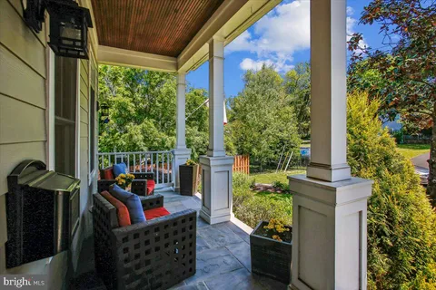 a view of an entryway with wooden floor
