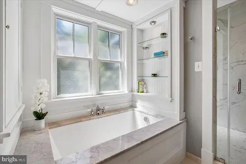 a bathroom with a toilet a sink and a mirror