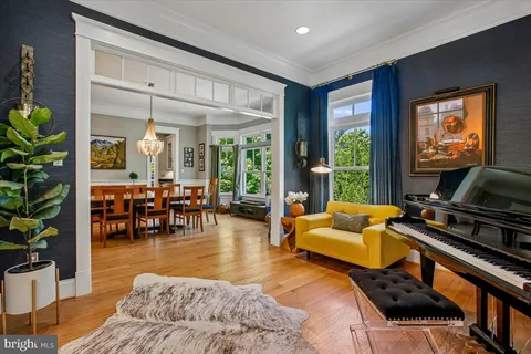 a dining room with furniture and window