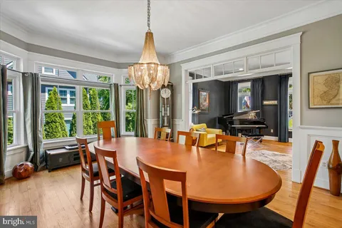 a kitchen with stainless steel appliances granite countertop stove a sink a microwave and wooden floors