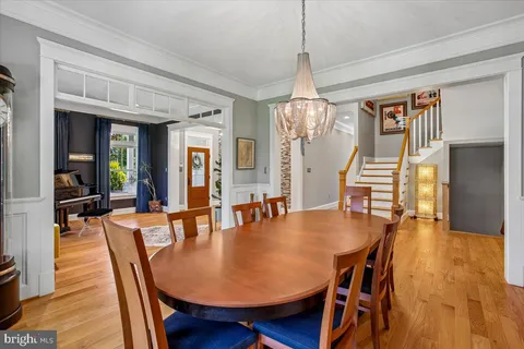 a kitchen with stainless steel appliances granite countertop wooden floor and large windows