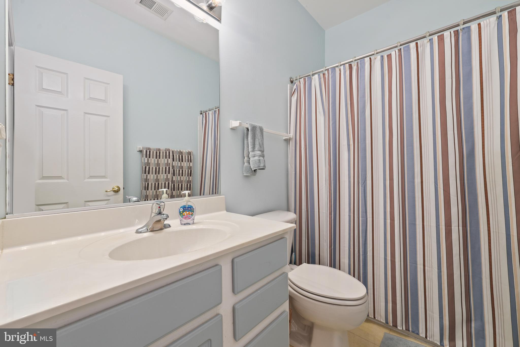 6806 Witton Circle Gainesville, VA 20155 - Photo 23 of 47 a bathroom with a sink toilet and mirror