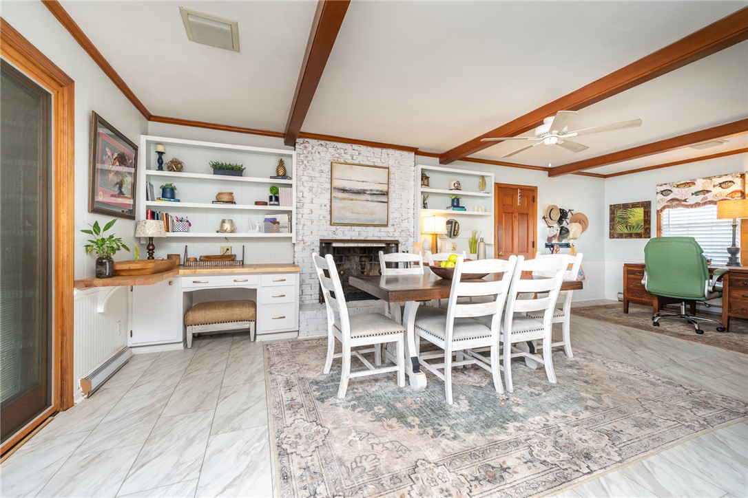 401 South Glassy Mountain Road Pickens, SC 29671 - Photo 24 of 37 This versatile space features a fireplace, built-in shelving, and beamed ceilings.