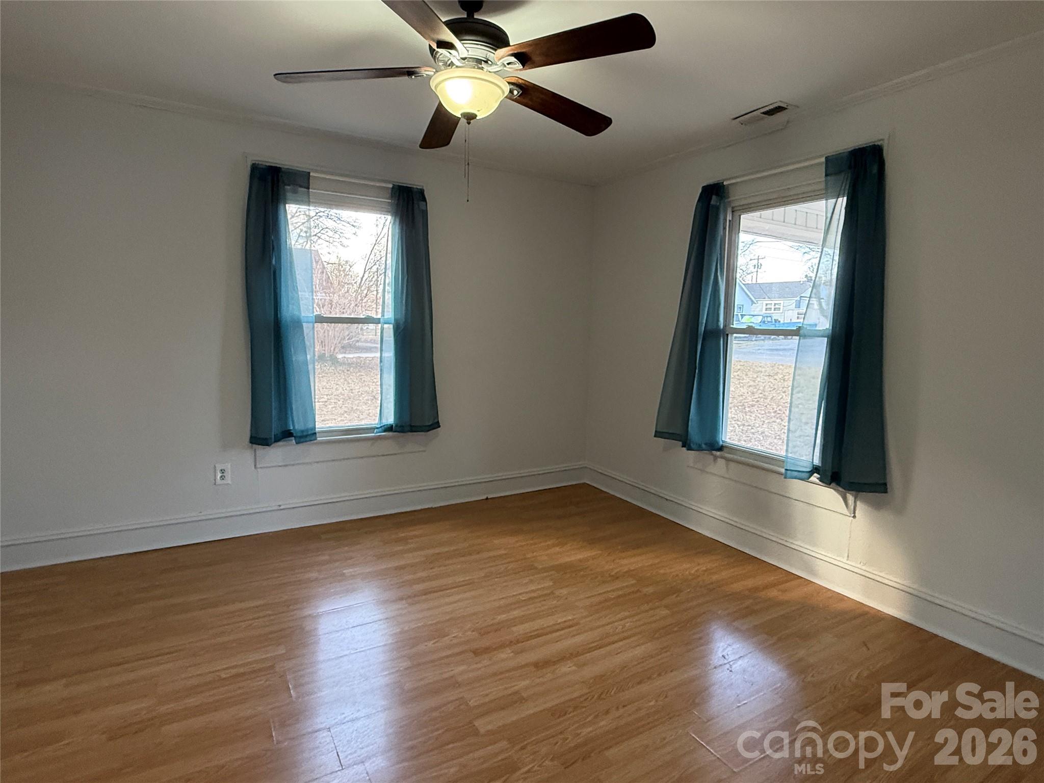 2603 5th Avenue Southwest Hickory, NC 28602 - Photo 12 of 31 a view of an empty room with wooden floor and a window
