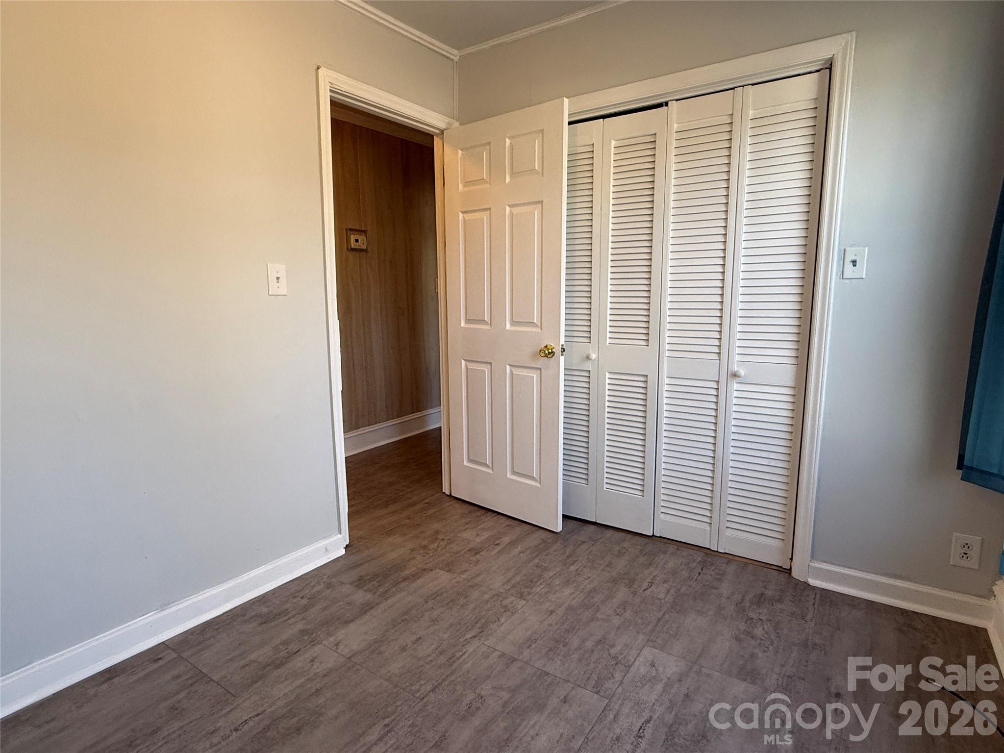 2603 5th Avenue Southwest Hickory, NC 28602 - Photo 16 of 31 an empty room with wooden floor and windows