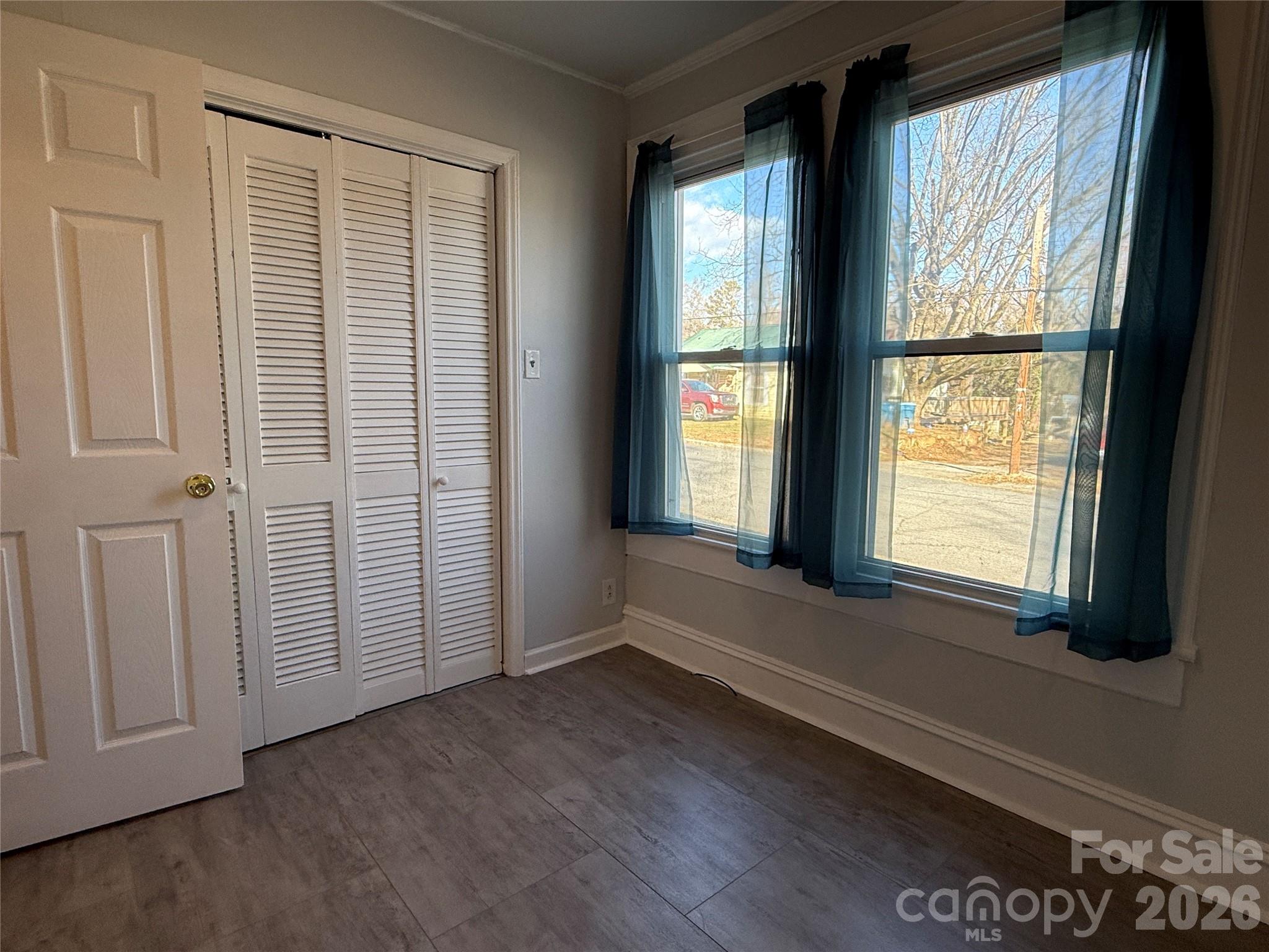 2603 5th Avenue Southwest Hickory, NC 28602 - Photo 17 of 31 an empty room with wooden floor and windows