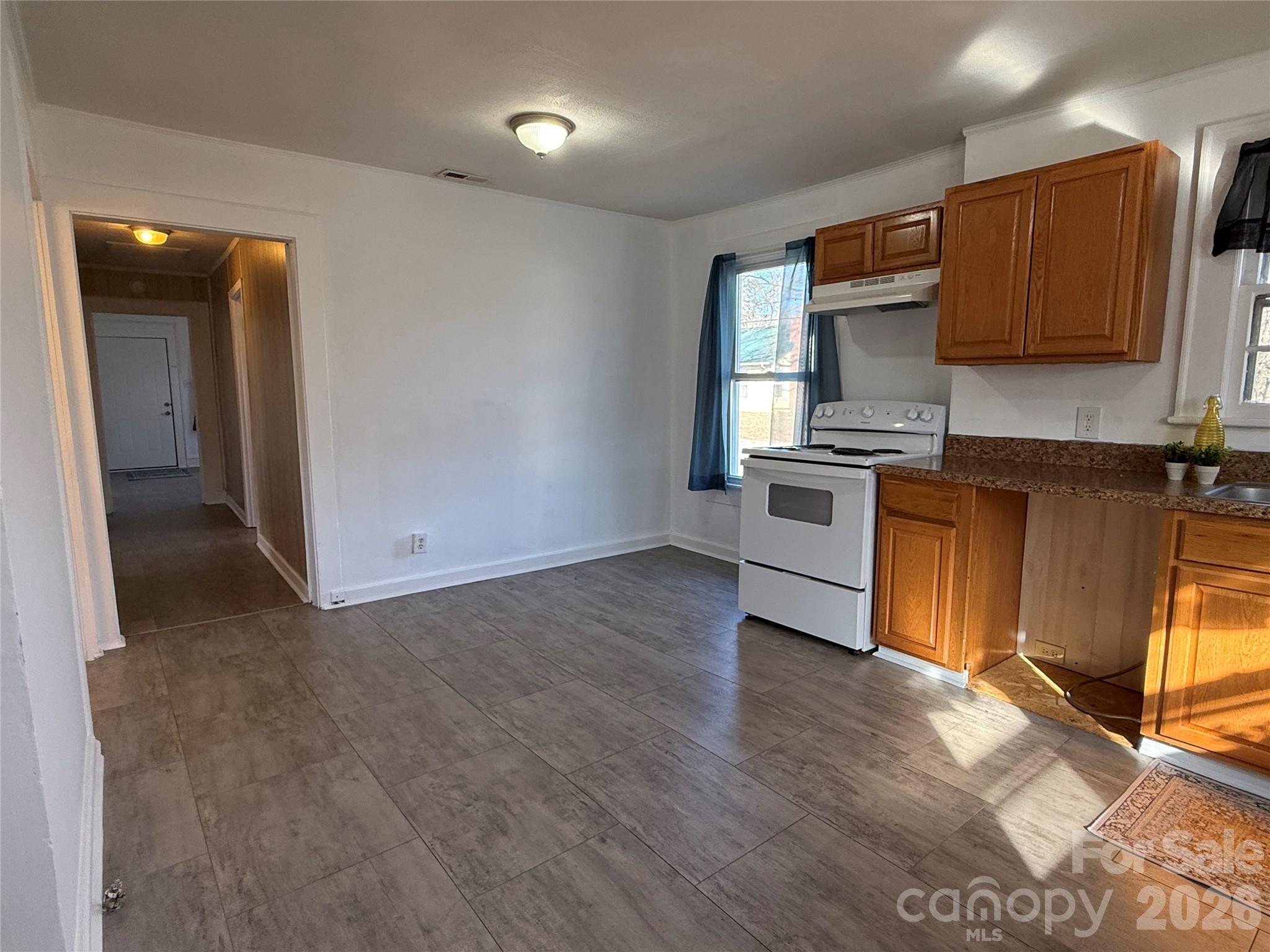 2603 5th Avenue Southwest Hickory, NC 28602 - Photo 22 of 31 a kitchen with a refrigerator stove top oven and sink