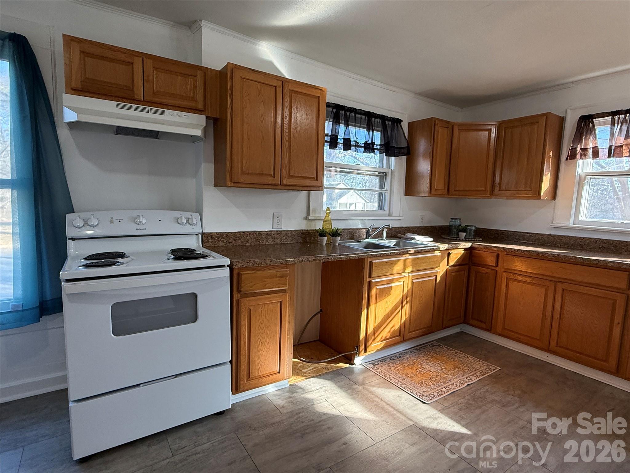 2603 5th Avenue Southwest Hickory, NC 28602 - Photo 23 of 31 a kitchen with granite countertop a sink stainless steel appliances and cabinets