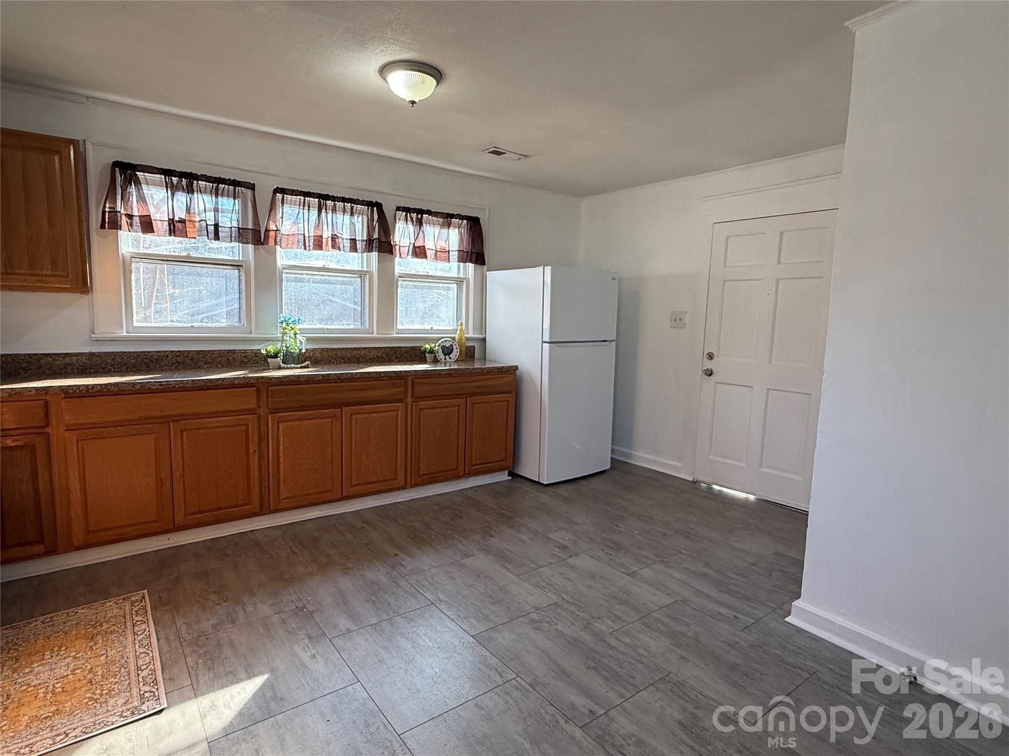 2603 5th Avenue Southwest Hickory, NC 28602 - Photo 24 of 31 a view of a kitchen with window and wooden floor