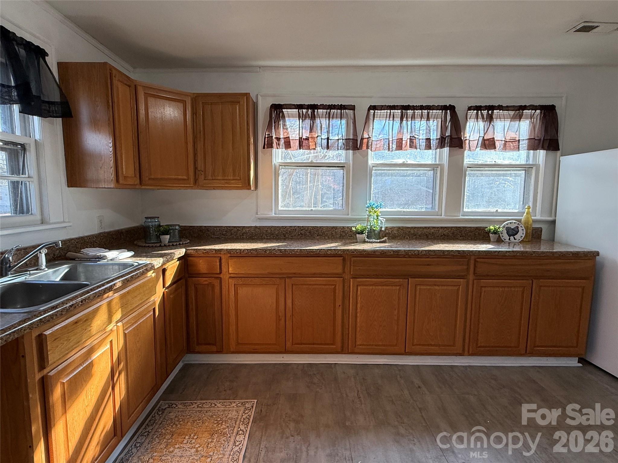 2603 5th Avenue Southwest Hickory, NC 28602 - Photo 25 of 31 a kitchen with stainless steel appliances granite countertop a sink stove and cabinets