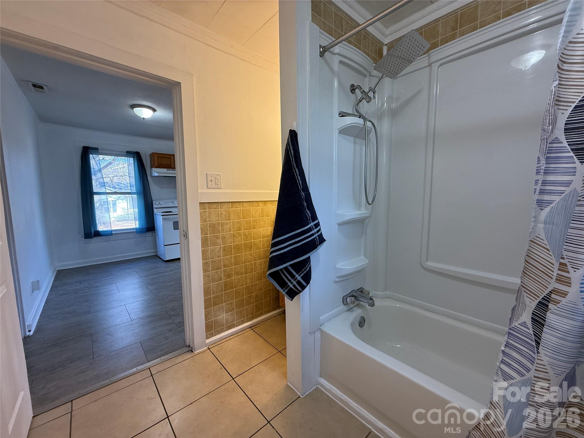 2603 5th Avenue Southwest Hickory, NC 28602 - Photo 26 of 31 a bathroom with a tub a sink and a glass door shower