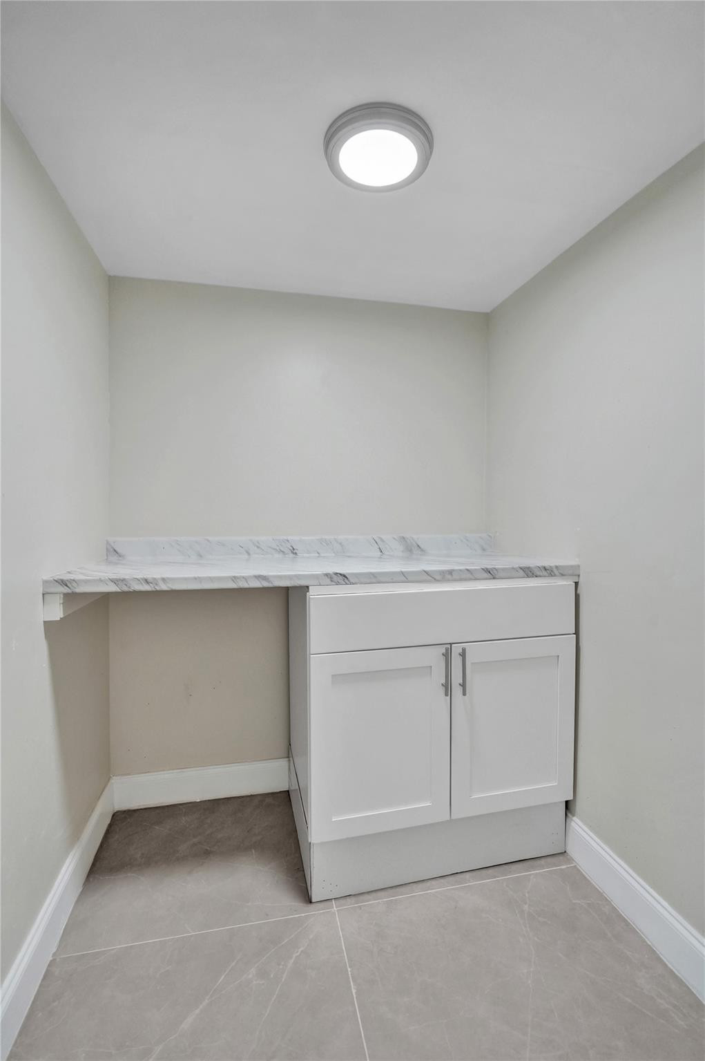 4222 Inverrary Boulevard, Unit 4810 Lauderhill, FL 33319 - Photo 54 of 63 an empty room with white cabinets