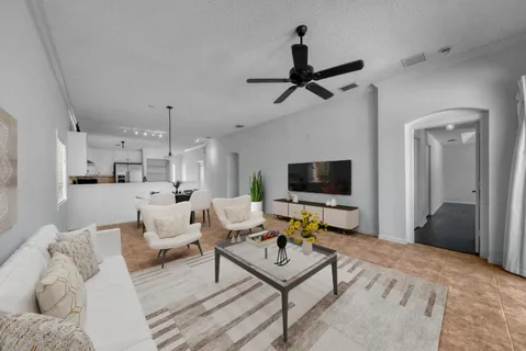 a view of a kitchen with a refrigerator and window