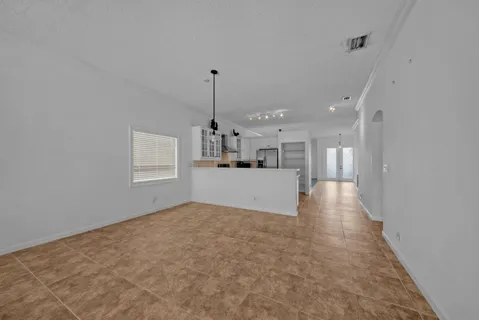 a view of a kitchen with a sink and cabinets