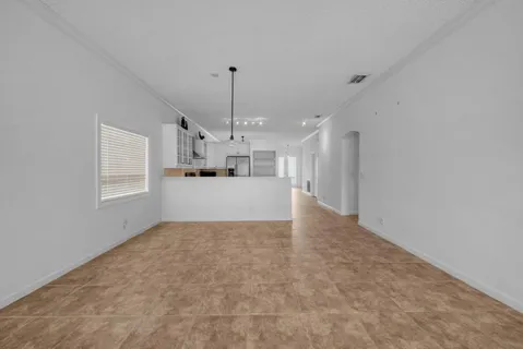 a view of a kitchen with a sink and cabinets