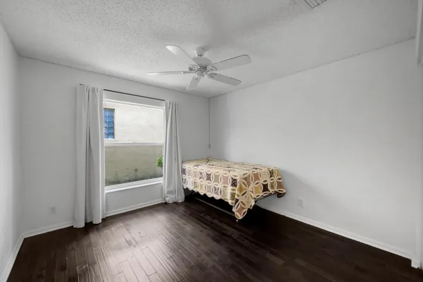 a room with a bed and a table in it