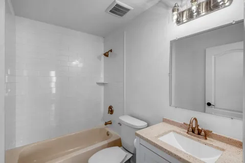 a view of a swimming pool with a patio and a garden