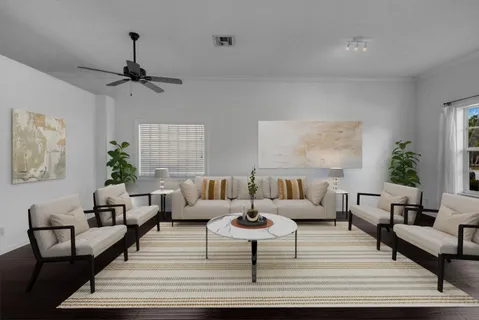 a view of an empty room with wooden floor and window