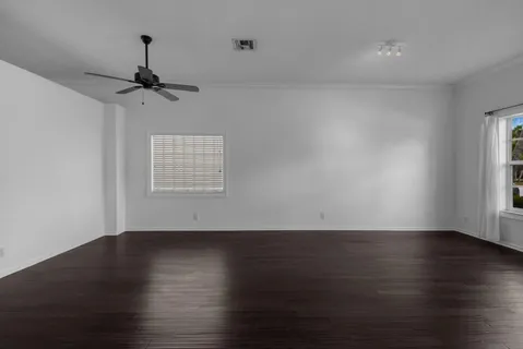 a kitchen with granite countertop a refrigerator stove top oven and sink