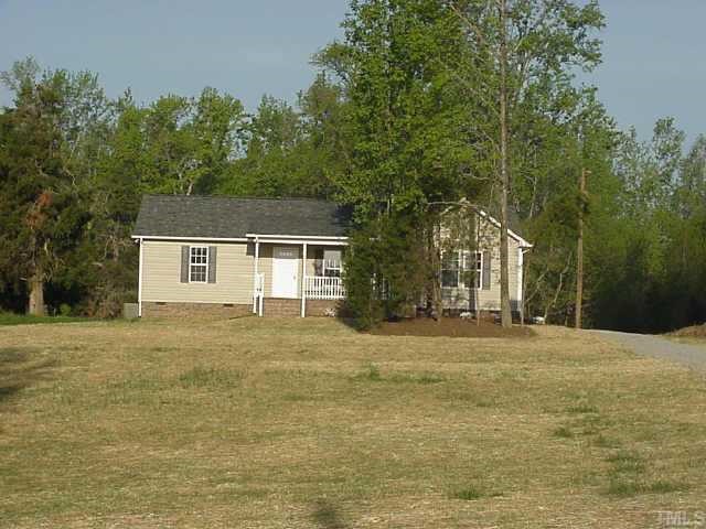 330 Hill Road Rougemont, NC 27572 - Photo 1 of 1 a front view of a house with a garden