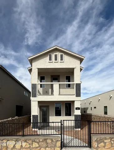 a front view of a house with glass windows