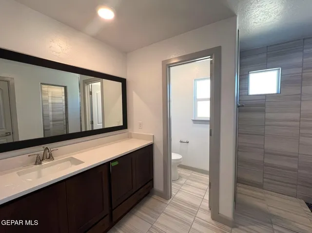 a view of a bathroom from a hallway